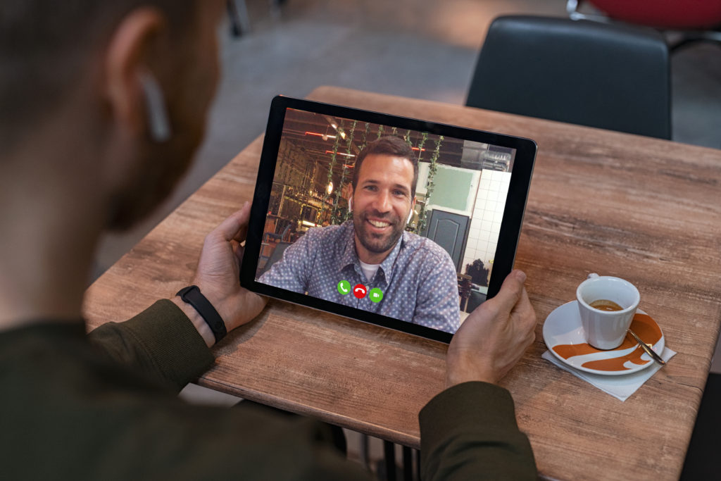 Man doing video call on tablet